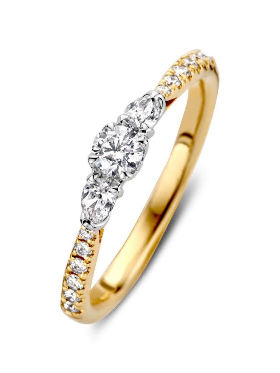 Bicolor driesteens ring met briljant 0,51 crt. Bicolor driesteens ring met briljant 0,51 crt.