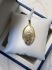 Vintage geelgouden medaillon met sierbloemen