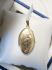 Vintage geelgouden medaillon met sierbloemen